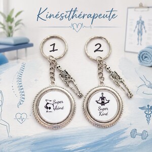 May include: Two silver-toned circular keychains with metal rings, each featuring a small skeleton charm. Keychain 1 displays the text 'Super Kiné' with a graphic, while keychain 2 shows a skeleton in a yoga pose with the text 'Super Kiné'.
