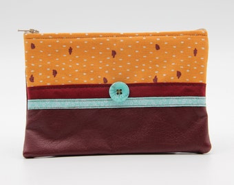 Burgundy and mustard clutch