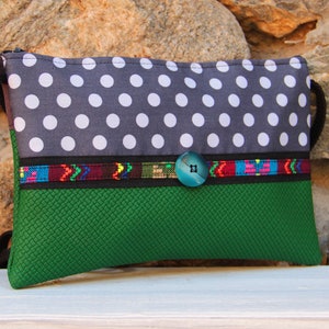 Green and grey shoulder strap pouch with white polka dots