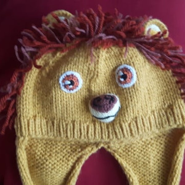 Bonnet "lion" avec cache-oreilles et écharpe intégrés