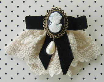 Cameo brooch and lace