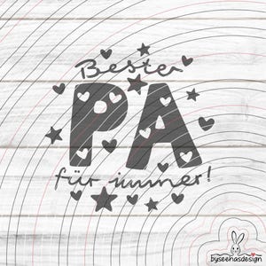 May include: A graphic design with the words "Bester PA für immer!" in a handwritten style, with the letters "PA" filled with a pattern. The design includes stars and hearts, set against a white wood grain background.