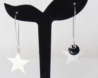 Long earrings with asymmetrical silver star-shaped posts. Handmade.