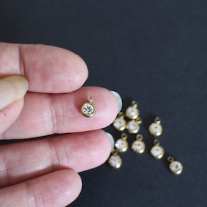 10 round rhinestone charms in gold stainless steel 8 x 6 mm for refined and glamorous jewelry creations