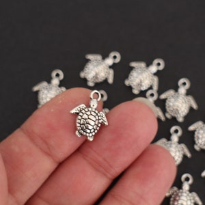 10 pingentes de tartaruga em metal prateado 16 x 14 mm