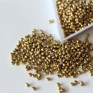 Perline di vetro rotonde dorate da 2 mm