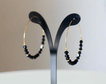 Hoop earrings in gold stainless steel and discreet and elegant black glass top beads Handmade