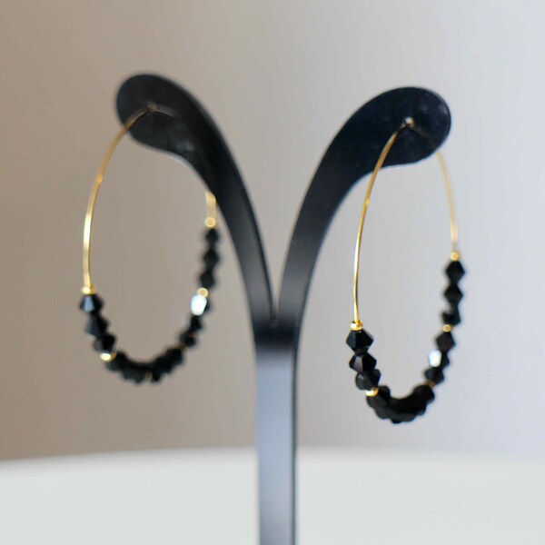 Hoop earrings in gold stainless steel and discreet and elegant black glass top beads Handmade