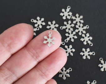 6 finely crafted snowflake charms in silver stainless steel 12 x 9 mm