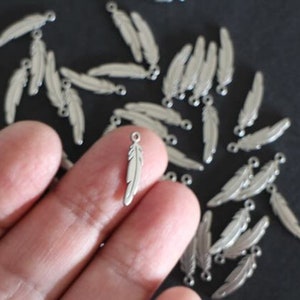 6 finely crafted silver stainless steel feather charms 17 x 4.5 mm image 1