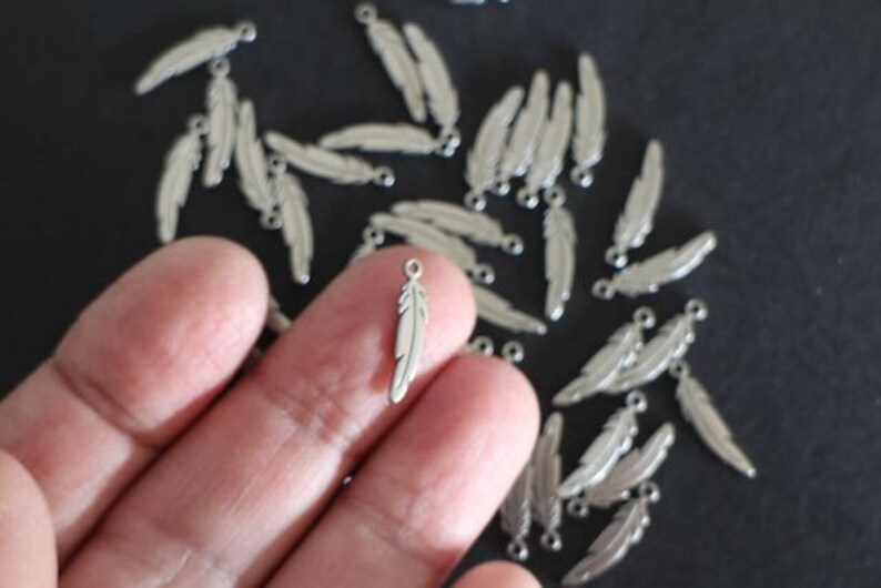 6 finely crafted silver stainless steel feather charms 17 x 4.5 mm image 1