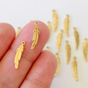6 finely crafted golden stainless steel feather charms 17 x 4.5 mm for your nature style jewelry creations