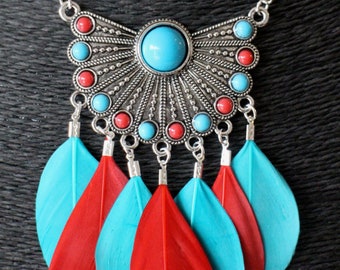 Long necklace with red and blue round feathers and print with matching small round cabochons Handmade