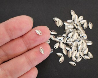 10 petites breloques feuilles en acier inoxydable argent 7 x 3,5 mm pour les finitions de vos créations bijoux