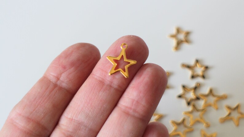 10 hollowed-out star charms in golden stainless steel 15 x 13 mm for timeless jewelry creations image 1