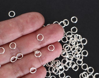 100 round open junction rings in silver-plated brass 6 mm findings which will embellish your jewelry creations