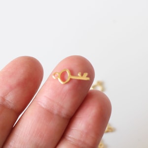 6 breloques clés en acier inoxydable doré 15 x 6 mm idéales pour la réalisation de vos bijoux image 1