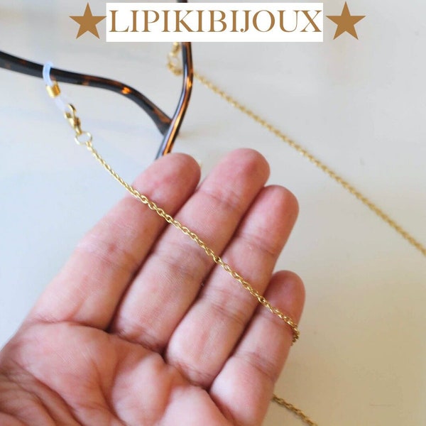 Une chaine pour lunettes en acier inoxydable doré avec liens en silicone transparents en forme d'infini de 8 Fait-main écrin cadeau offert