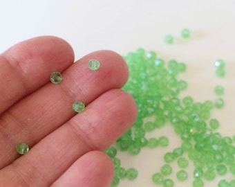 100 round light green faceted glass beads 4 x 3 mm
