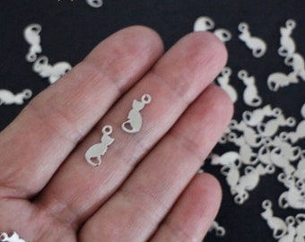 10 small cat charms sitting in silver stainless steel 13 x 5 mm
