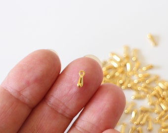 10 small gold stainless steel drop charms 7.5 x 2.5 mm for a beautiful finish to your jewelry