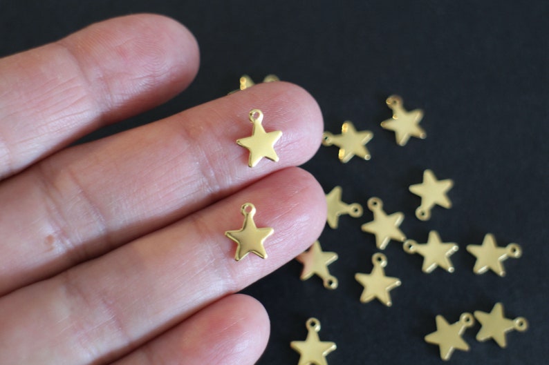 10 star charms in gold stainless steel 10 x 8 mm image 1