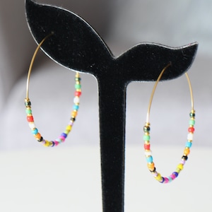 Gold stainless steel hoop earrings with multicolored seed beads that will match all your handmade outfits