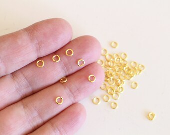 100 round open junction rings in golden brass 4mm basic findings essential for your jewelry creations