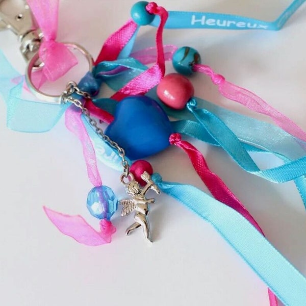 A bag charm keyring, multi-colored silver angel charm, different satin and organdy ribbons, pink blue and various pearls, handmade