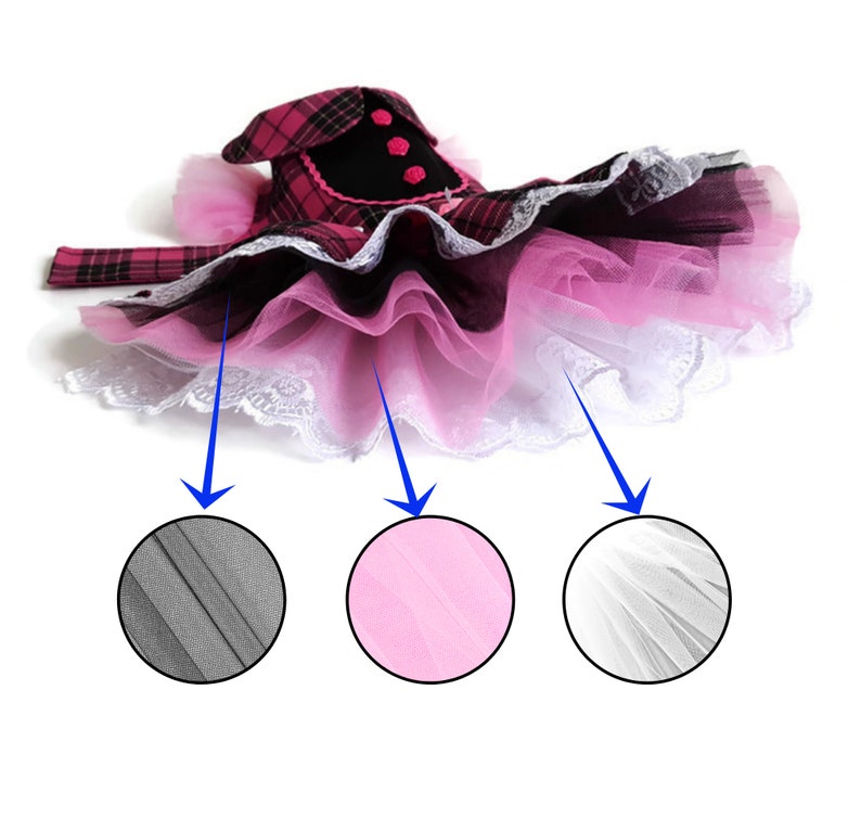 May include: A pink, black and white tulle tutu with a plaid bodice and black trim. The tutu has three layers of tulle: a black layer, a pink layer and a white layer.