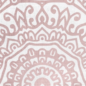 May include: A pink and white mandala pattern with intricate details. The pattern is symmetrical and has a circular shape. The background is a light pink color.