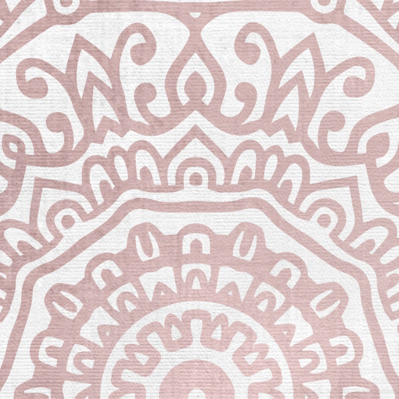 May include: A pink and white mandala pattern with intricate details. The pattern is symmetrical and has a circular shape. The background is a light pink color.