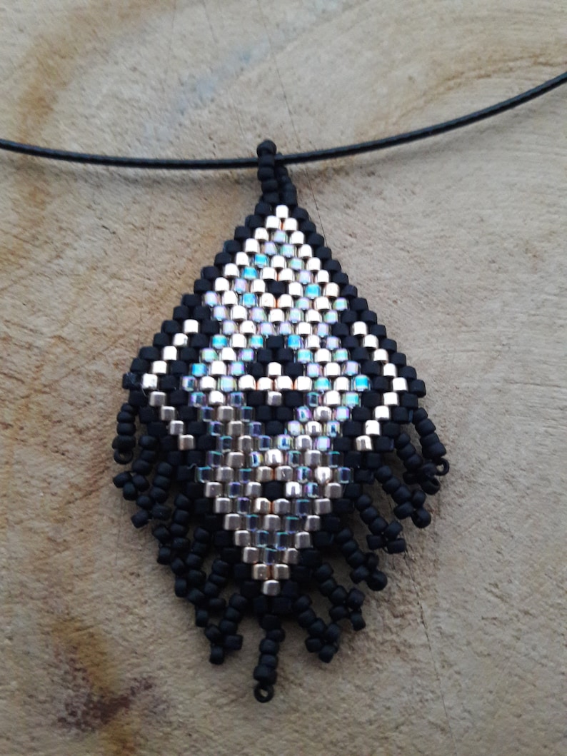Ethnic adornment in Miyuki delicas weaving.
