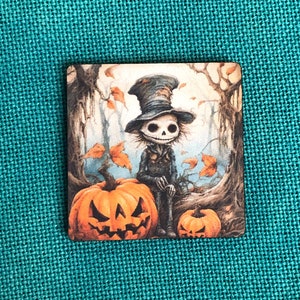 May include: Square Halloween-themed image featuring a skeleton character in a top hat, standing between two carved pumpkins. The background depicts a spooky forest with falling leaves. The color palette includes orange, black, and brown.