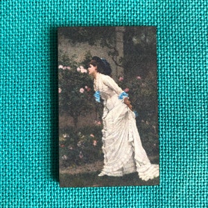 Woman And Roses Wooden Needle Minder
