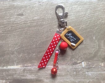 Porte clef bijou de sac "merci" cadeau maîtresse ruban rouge et grelot  rouge