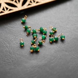 20 round faceted beads in emerald green and gold jade 4x8mm