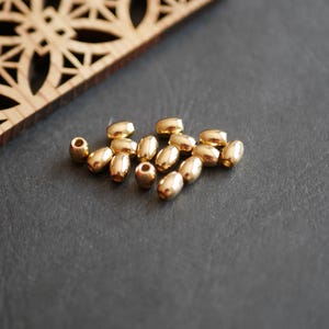 50 gold raw brass oval spacer beads, 5x6mm