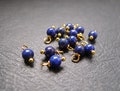 Set of 10 round natural stone charms. Blue and gold Lapis Lazuli, gold bells, 4x8mm product logo