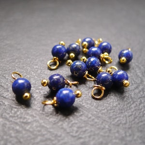 Set of 10 round natural stone charms. Blue and gold Lapis Lazuli, gold bells, 4x8mm