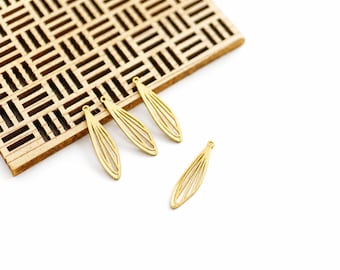 May include: Four gold-toned metal charms shaped like elongated, slender leaves or insect wings. Each charm features a delicate, open-work wire frame design with a small circular loop at the top for attachment, presented in a bright, clean finish.