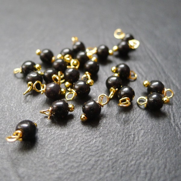 40 perles rondes en verre noir et doré 4x8mm breloques