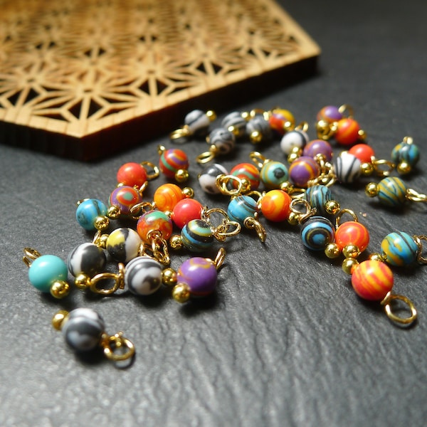 40 round pearls in colored and gilded granite 4x8mm