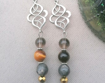 Boucles d'oreilles pendantes trois pierres