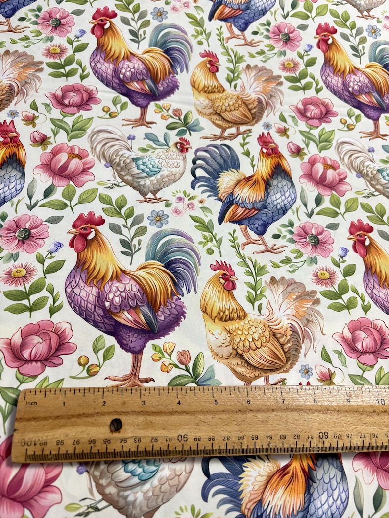 May include: A white fabric with a repeating pattern of colorful roosters and floral designs. The roosters are in various poses, some with their wings spread and others with their tails raised. The flowers are in shades of pink, purple, and yellow.
