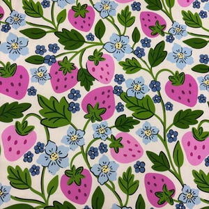 May include: A repeating pattern featuring pink strawberries, light blue flowers, and green leaves on a cream background. The design has a whimsical, illustrative style, perfect for fabric or wallpaper.
