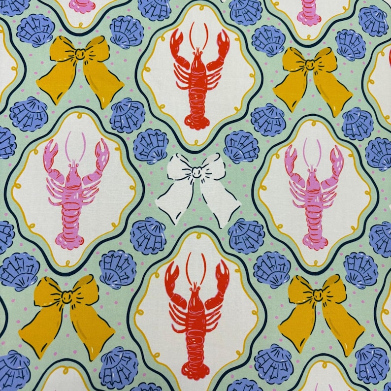 May include: A repeating pattern featuring red and pink lobsters, yellow bows, white bows, and blue seashells on a light green background. The design is framed by a decorative border, creating a whimsical and nautical theme.