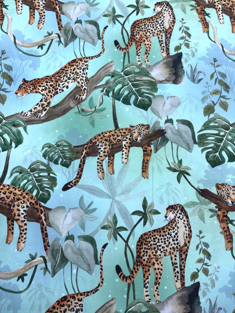 May include: A fabric pattern featuring multiple leopards in a jungle setting. The leopards have brown spots on a tan coat and are positioned on tree branches and the ground. The background is a light blue with green foliage.
