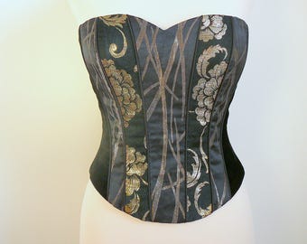 Bustier corset - velours noir et motifs jacquard dorés.