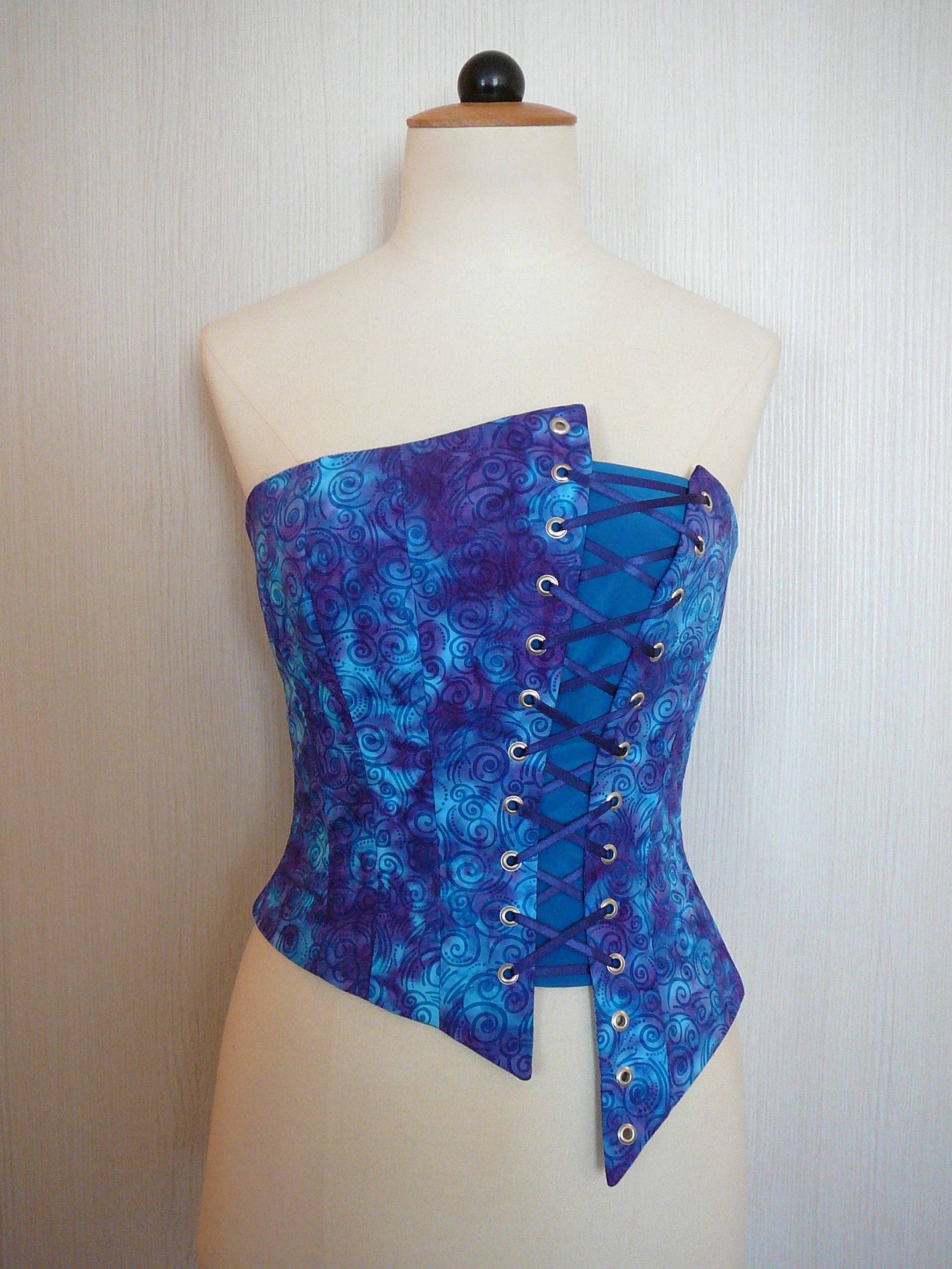 Asymmetric outlet bustier top